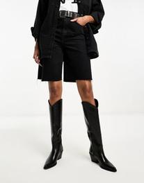 Oferta de & Other Stories leather low heel western thigh boots in black por $213 en ASOS