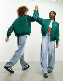 Oferta de Adidas Originals SST unisex track jacket in collegiate green por $91 en ASOS