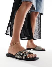Oferta de RAID Avalone flat sandals in black por $29,99 en ASOS