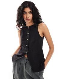 Oferta de ASOS DESIGN high neck waistcoat with linen in black por $37,99 en ASOS