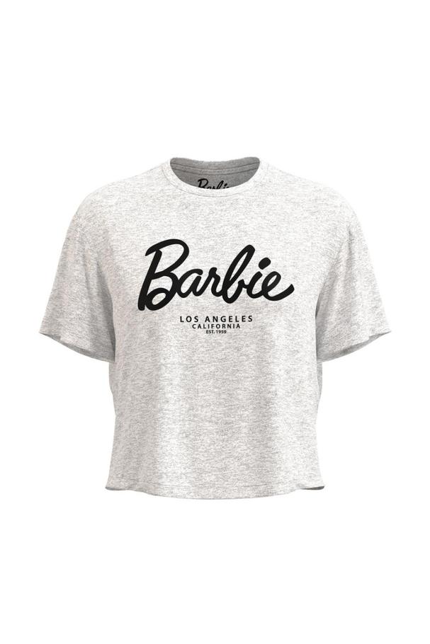 Oferta de Camiseta unicolor crop top con arte de Barbie y manga corta por $34900 en Koaj
